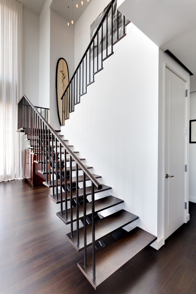 This is an example of a contemporary staircase in New York with open risers.