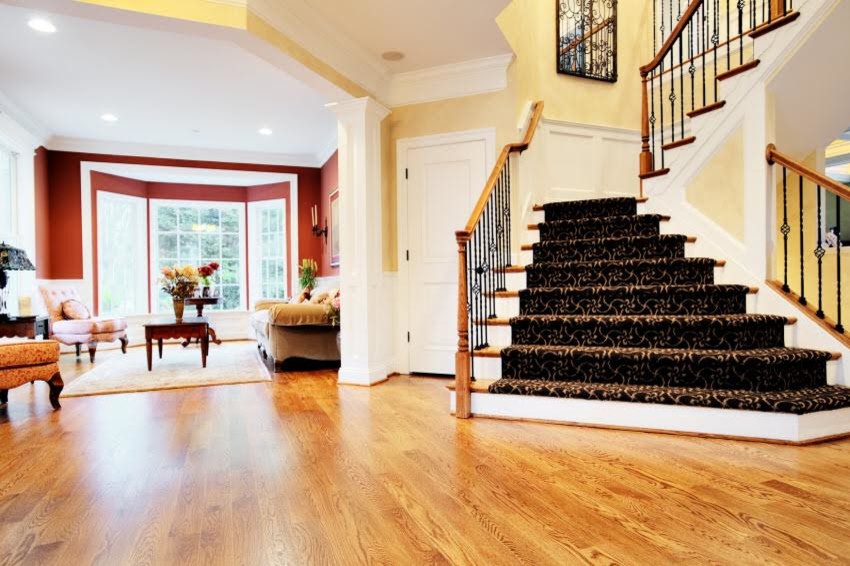Example of a mid-sized transitional carpeted l-shaped mixed material railing staircase design in Atlanta with carpeted risers