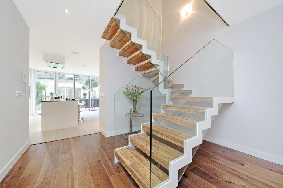 This is an example of a contemporary staircase in Oxfordshire with feature lighting.