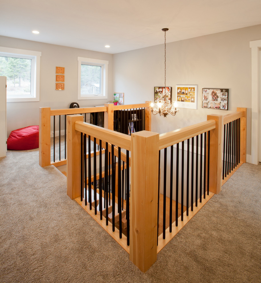 Medium sized classic wood u-shaped staircase in Vancouver with wood risers.