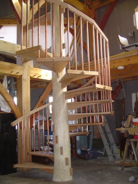 Inspiration for a contemporary wooden staircase remodel in Burlington with wooden risers