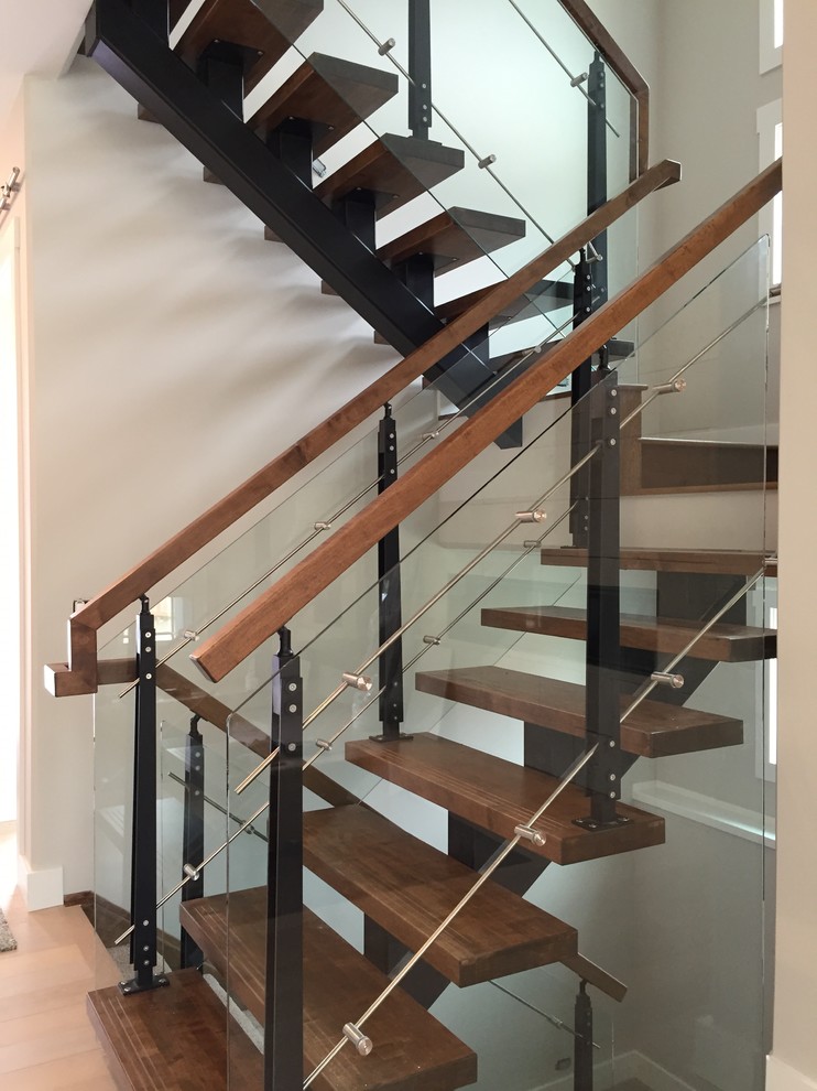 Staircase - mid-sized modern wooden u-shaped open staircase idea in Calgary