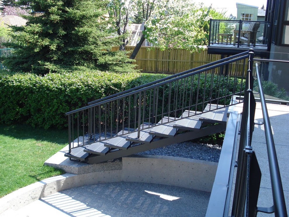 Design ideas for a medium sized contemporary metal straight staircase in Calgary with open risers.