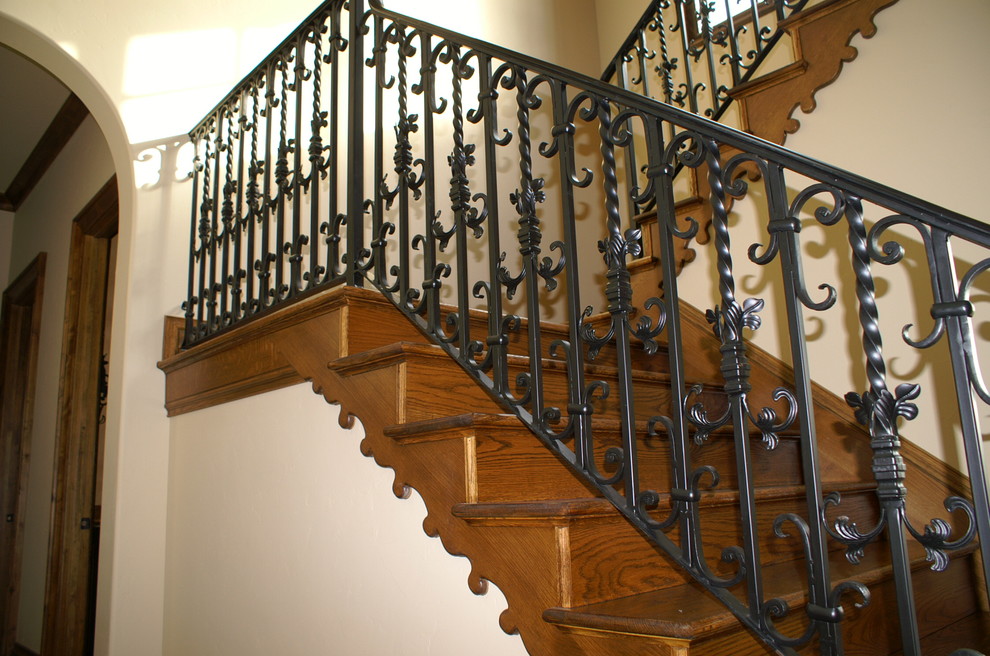Example of a large tuscan wooden u-shaped staircase design in Dallas with wooden risers