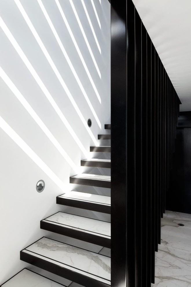 This is an example of a modern floating staircase in Other.