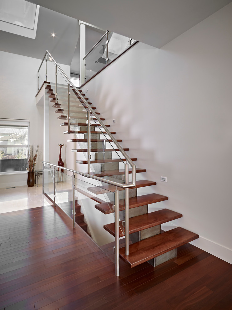 Design ideas for a contemporary glass railing staircase in Edmonton.