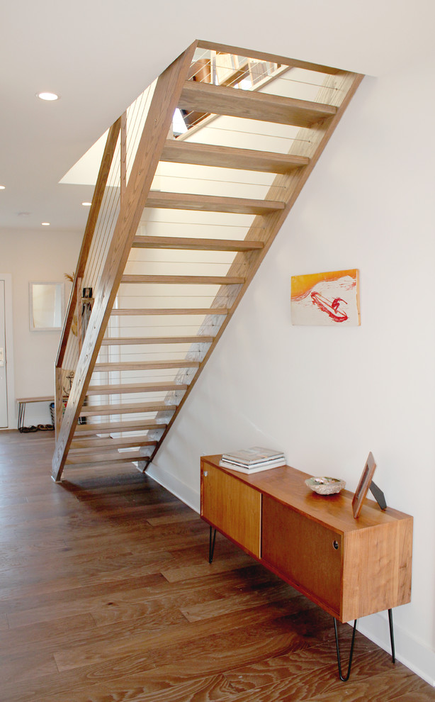 Example of a large beach style wooden straight open staircase design in Philadelphia