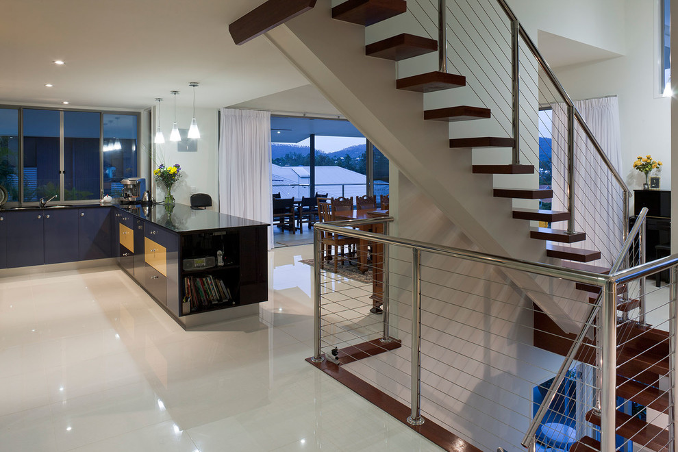 This is an example of a large wood straight staircase in Brisbane with metal risers.
