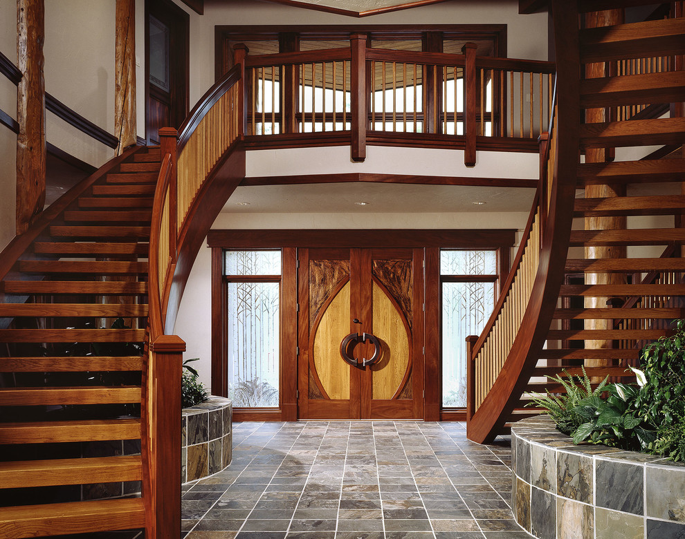 Staircase - mid-sized traditional wooden curved open staircase idea in Other