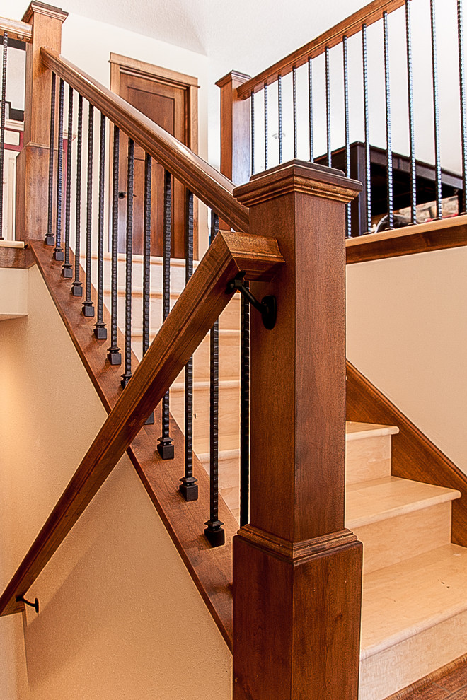 Photo of a traditional wood staircase in Minneapolis with wood risers.