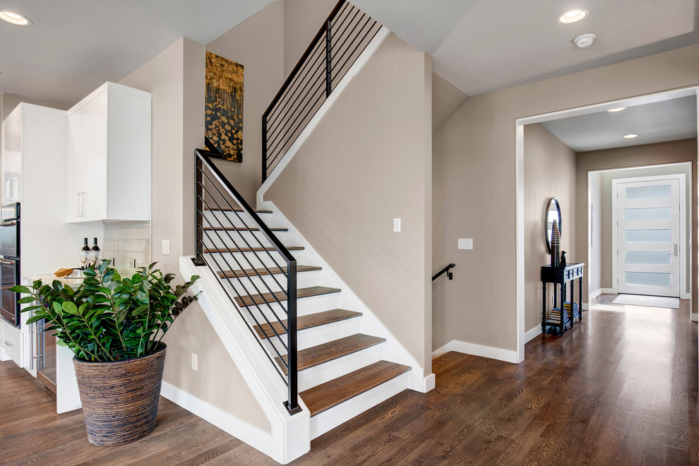 Staircase - contemporary wooden l-shaped metal railing staircase idea in Seattle with wooden risers