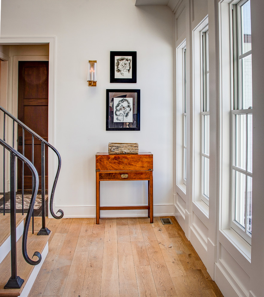 Inspiration for a mid-sized transitional wooden straight staircase remodel in Indianapolis with painted risers