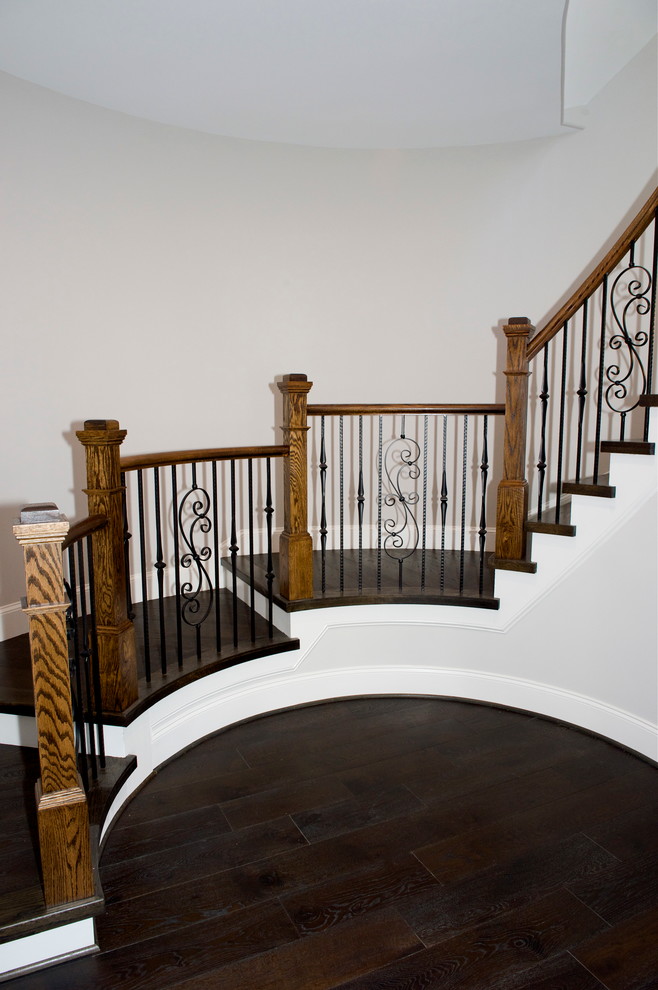 Exemple d'un escalier chic avec des marches en bois.