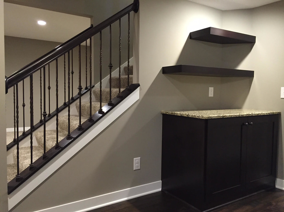 This is an example of a medium sized classic carpeted straight mixed railing staircase in Minneapolis with carpeted risers.