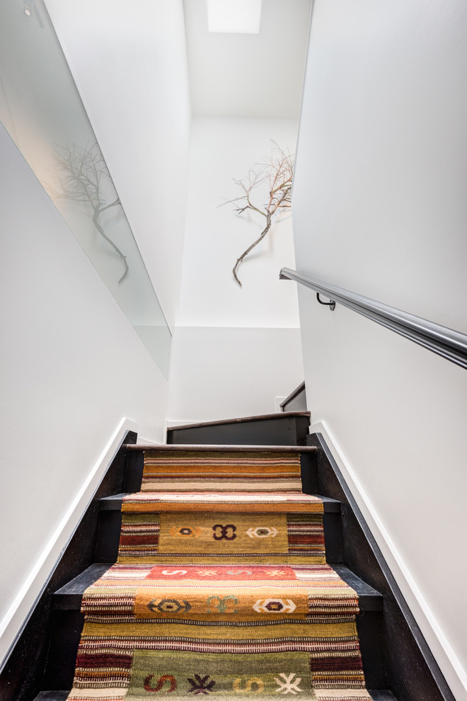 Inspiration for a small contemporary wooden u-shaped staircase remodel in Toronto with wooden risers