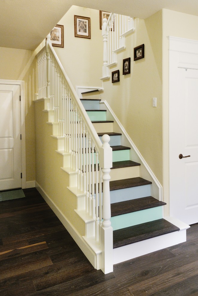 Mid-sized eclectic wooden u-shaped staircase photo in Sacramento with wooden risers