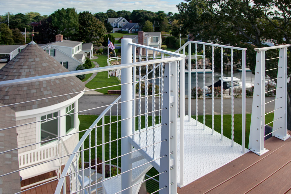 Mid-sized beach style metal spiral open and metal railing staircase photo in Boston