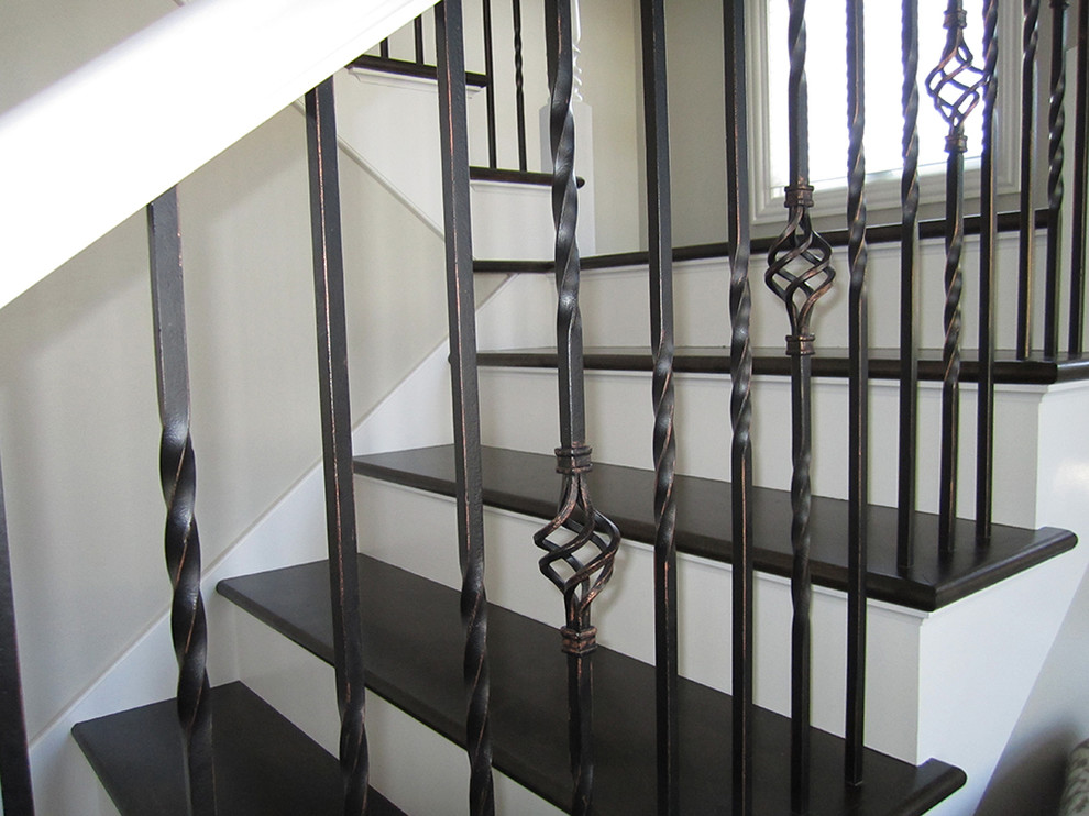 Inspiration for a mid-sized timeless wooden u-shaped wood railing staircase remodel in Chicago with wooden risers