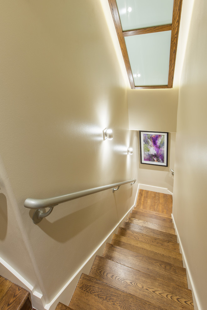 Photo of a medium sized modern wood straight staircase in Austin with wood risers.