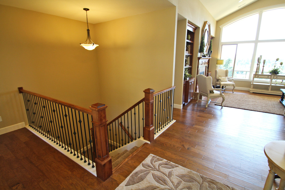 Medium sized classic carpeted u-shaped staircase in Portland with carpeted risers.