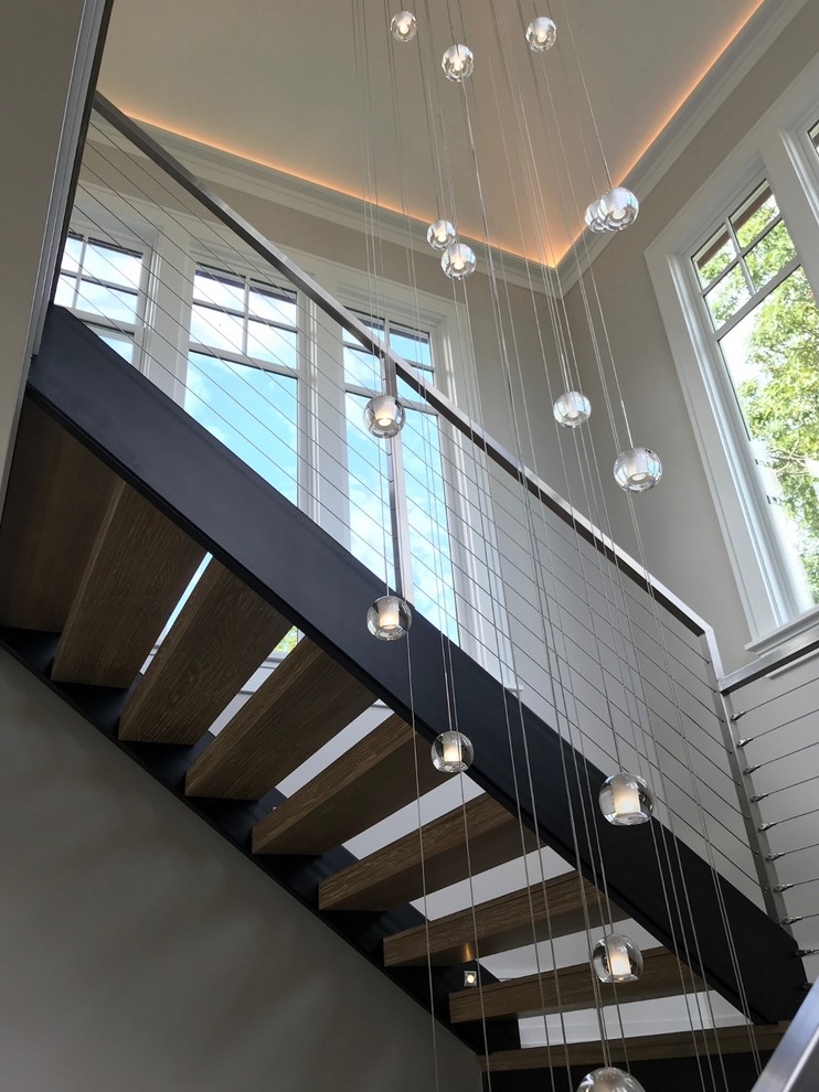 Inspiration for a contemporary floating metal railing staircase in Boston.