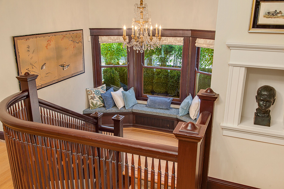 Inspiration for a large timeless wooden curved staircase remodel in Seattle with wooden risers