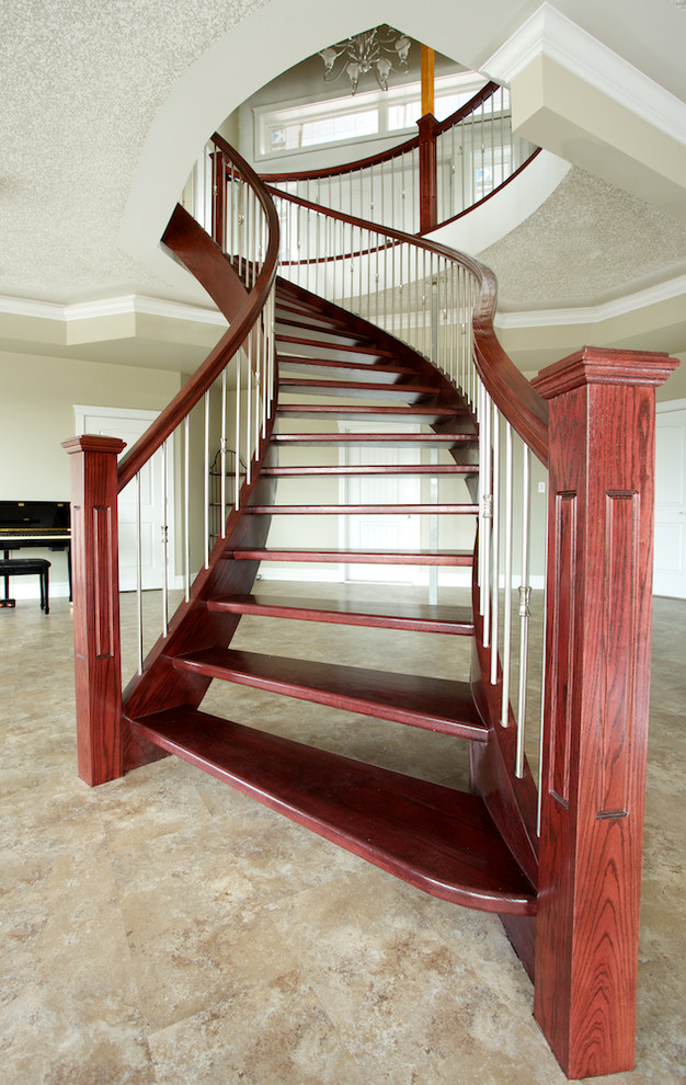Inspiration for a classic wood curved staircase in Edmonton with wood risers.