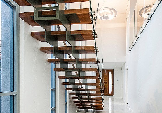 This is an example of a large contemporary wood straight staircase in Perth with open risers.