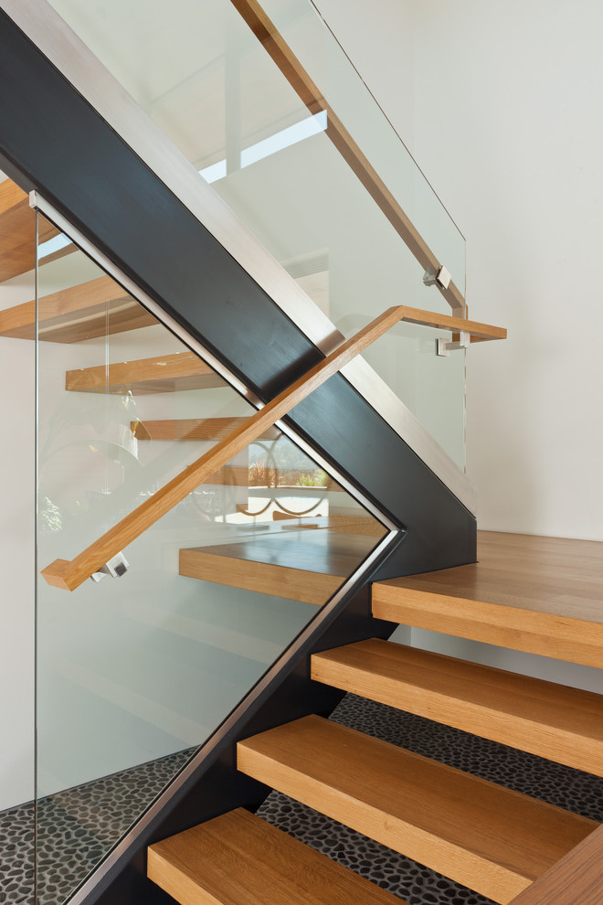 Inspiration for a large modern wooden staircase remodel in San Francisco with wooden risers