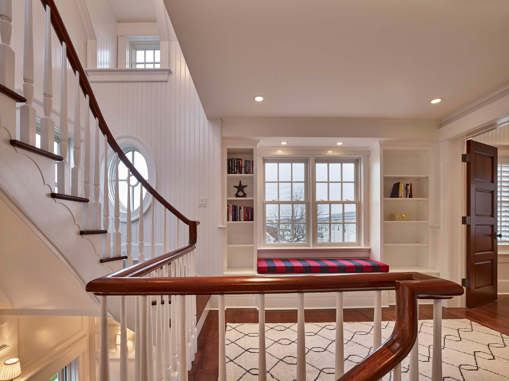 Design ideas for a medium sized nautical wood curved wood railing staircase in Philadelphia with painted wood risers.