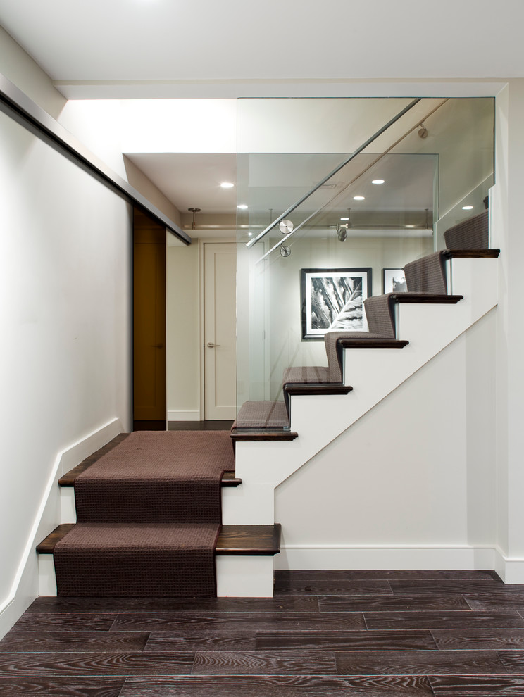 This is an example of a contemporary wood l-shaped staircase in Boston.
