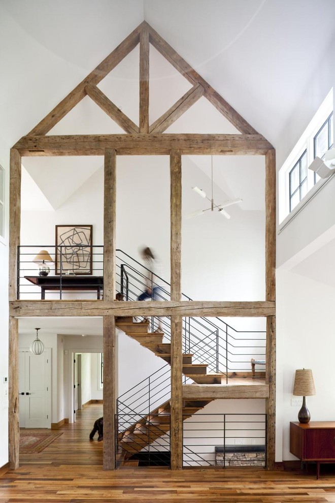 Inspiration for a large farmhouse staircase in San Francisco with feature lighting.