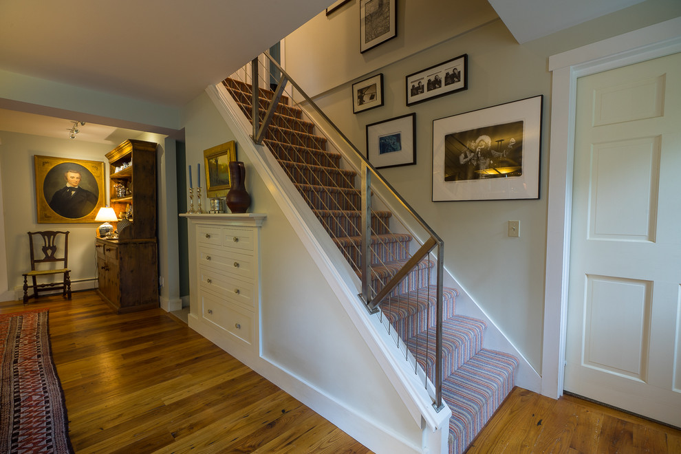 Inspiration for an eclectic carpeted straight staircase remodel in Burlington