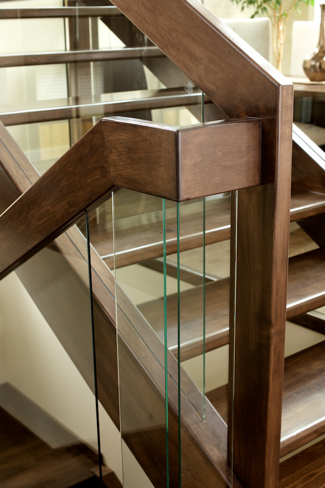Inspiration for a contemporary wooden u-shaped open and glass railing staircase remodel in Edmonton