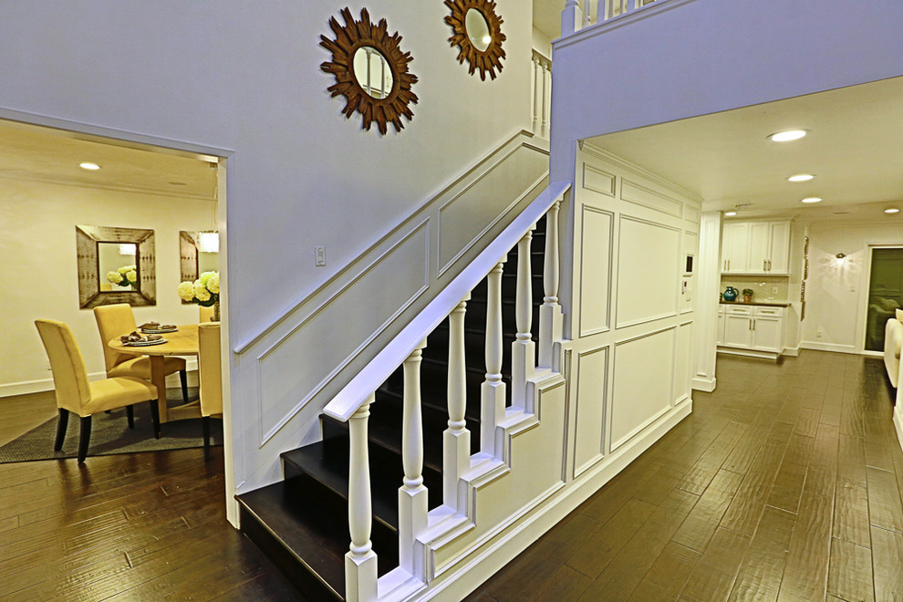 Inspiration for a small timeless wooden straight wood railing staircase remodel in Los Angeles with wooden risers
