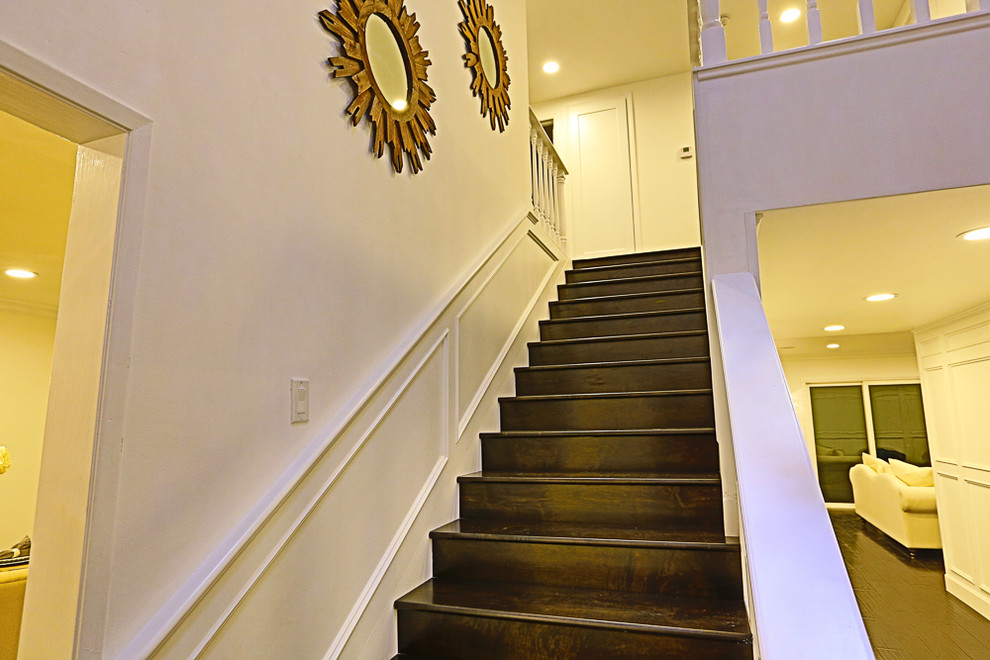 Inspiration for a small traditional wood straight wood railing staircase in Los Angeles with wood risers.