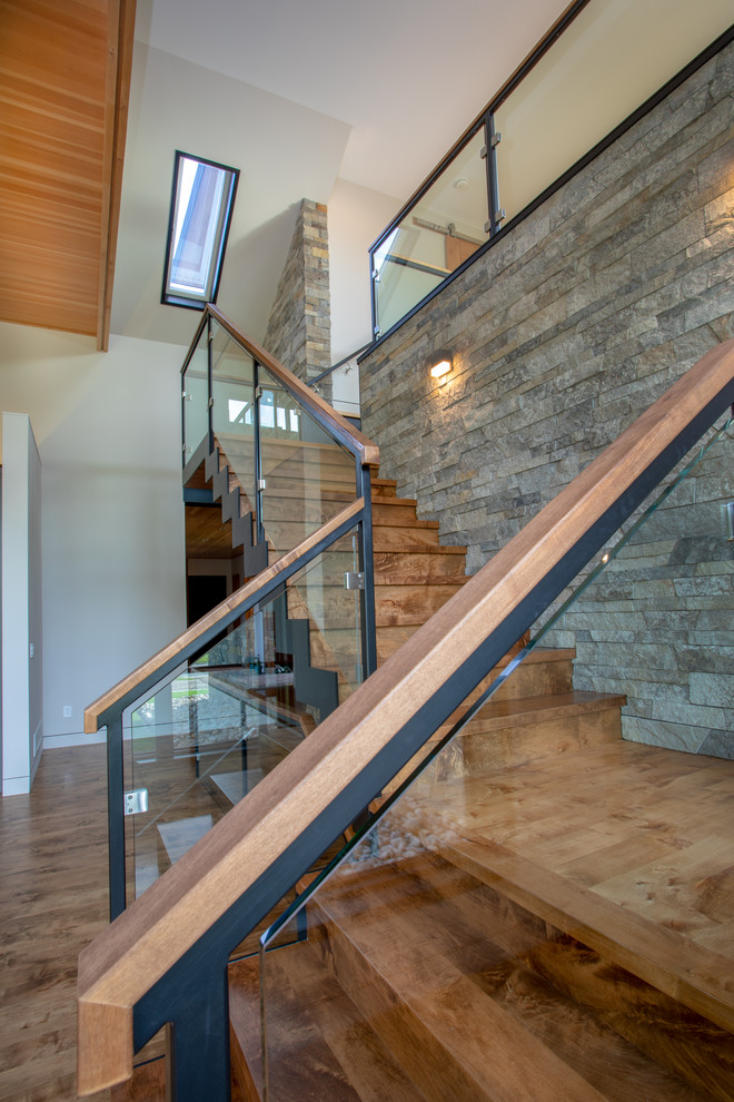 Example of a large minimalist wooden l-shaped mixed material railing staircase design in Other with wooden risers