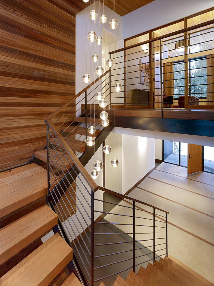 This is an example of a midcentury wood staircase in Sacramento with open risers.