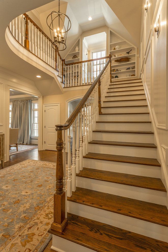 Example of a mid-sized classic wooden l-shaped wood railing staircase design in Other with painted risers