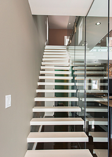 Photo of an expansive industrial metal straight staircase in Other with metal risers.