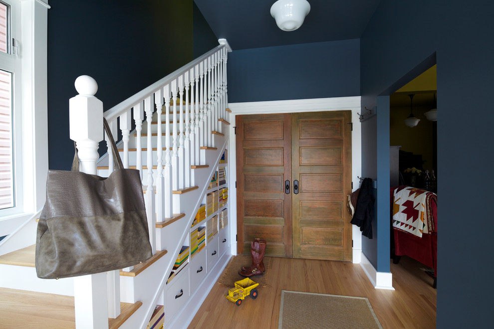 Medium sized traditional wood straight wood railing staircase in Calgary with painted wood risers.
