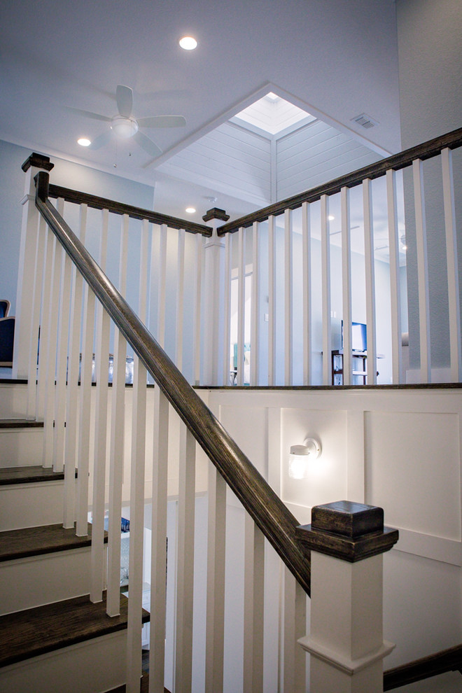 Example of a mid-sized country wooden u-shaped wood railing staircase design in Dallas with painted risers
