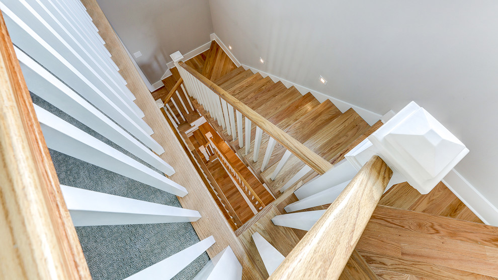 Photo of a coastal wood l-shaped wood railing staircase in Other.