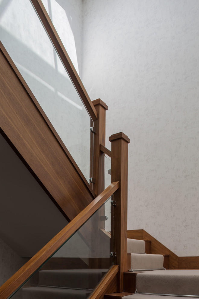 Inspiration for a large contemporary wood l-shaped wood railing staircase in Surrey with wood risers.