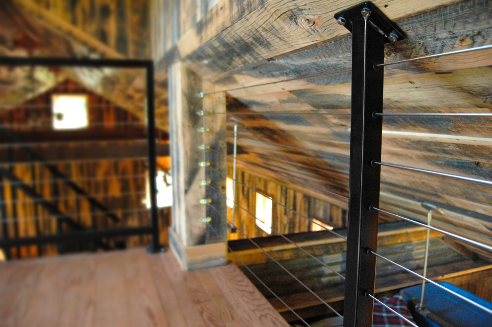 Inspiration for a mid-sized country wooden spiral staircase remodel in Philadelphia with metal risers