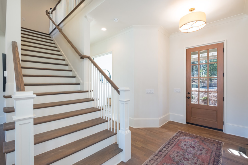 Photo of a classic staircase in Charlotte with feature lighting.