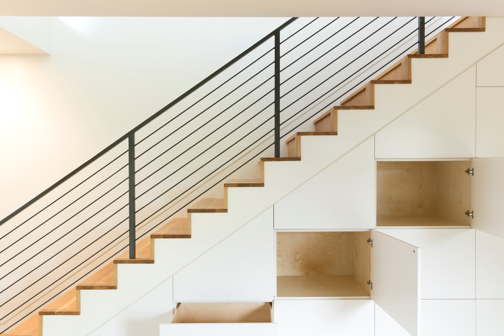 Large trendy wooden straight staircase photo in Austin with wooden risers