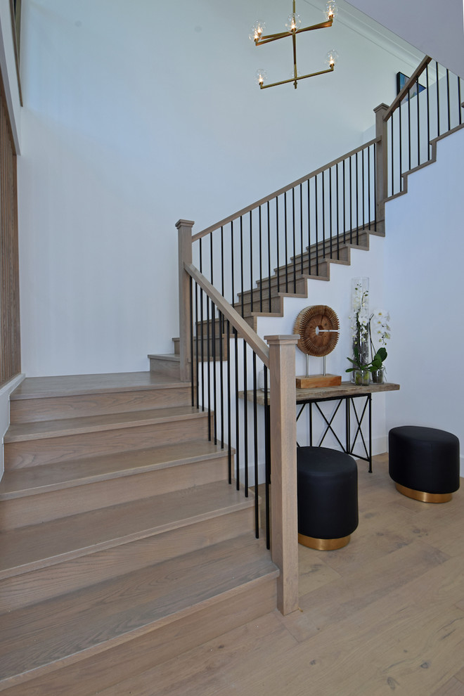 Example of a huge farmhouse staircase design in Los Angeles