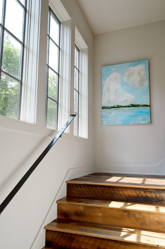 Large transitional wooden staircase photo in Nashville with wooden risers