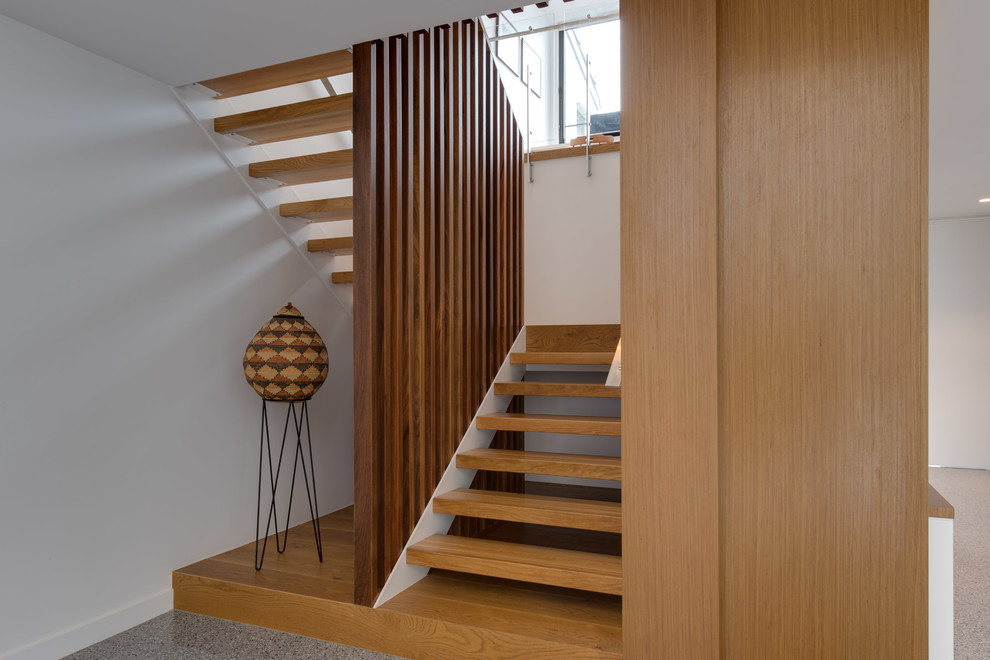 Trendy wooden u-shaped open and wood railing staircase photo in Brisbane